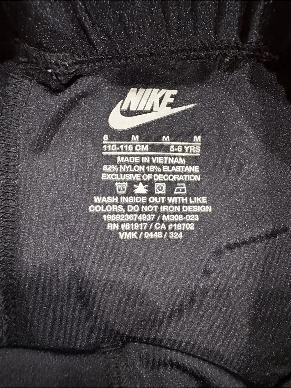 Nike Kids Black Leggings with Pink Swoosh Accent